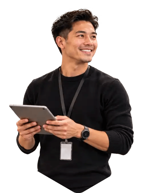 Retail team member smiling while holding a tablet